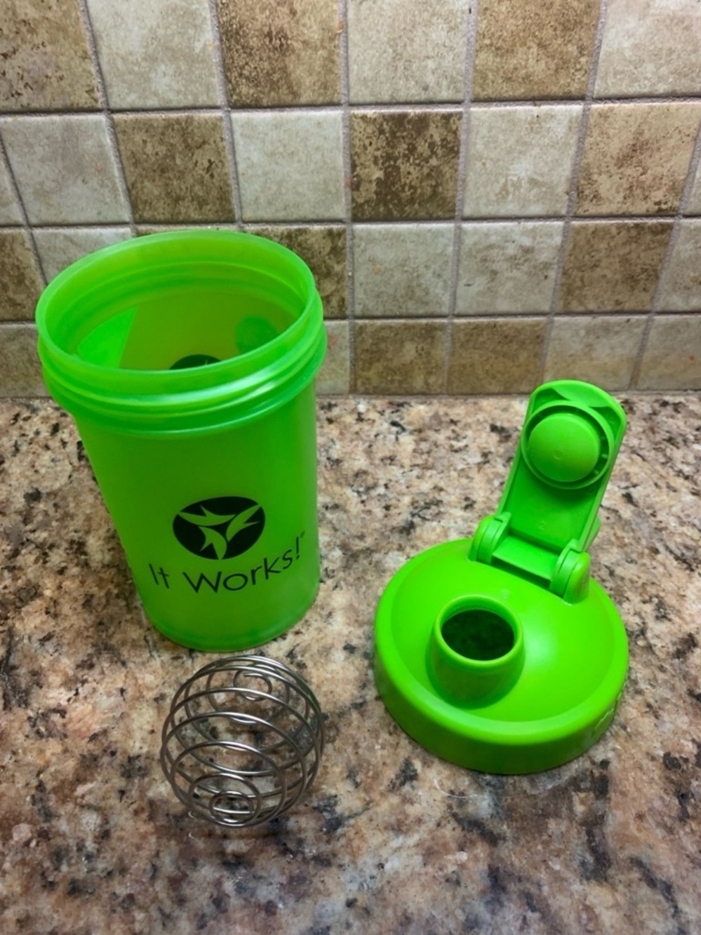Green BlenderBottle Classic V2 shaker bottle with a flip-top lid & carry loop.